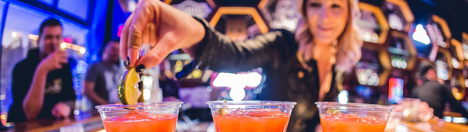 Indie on Main - bartender placing lime in drink