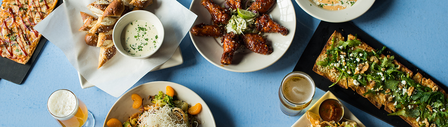 No Other Pub - Overhead view of wings and other dishes